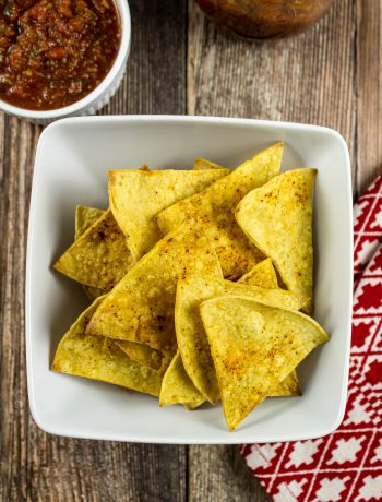 Baked Tortilla Chips are a healthy alternative to store bought chips. Easy to make and only a few ingredients! Low fat and packed with delicious flavors. Weight Watchers friendly recipe! www.bitesofflavor.com